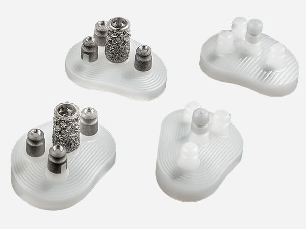Exactech Equinoxe Shoulder System Glenoid Options. Novel cage glenoid features a press-fit center bone cage and three cemented peripheral pegs.