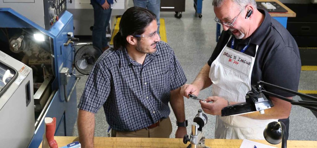 Exactech 2 employees working in the facilities manufacturing floor in Gainesville, FL